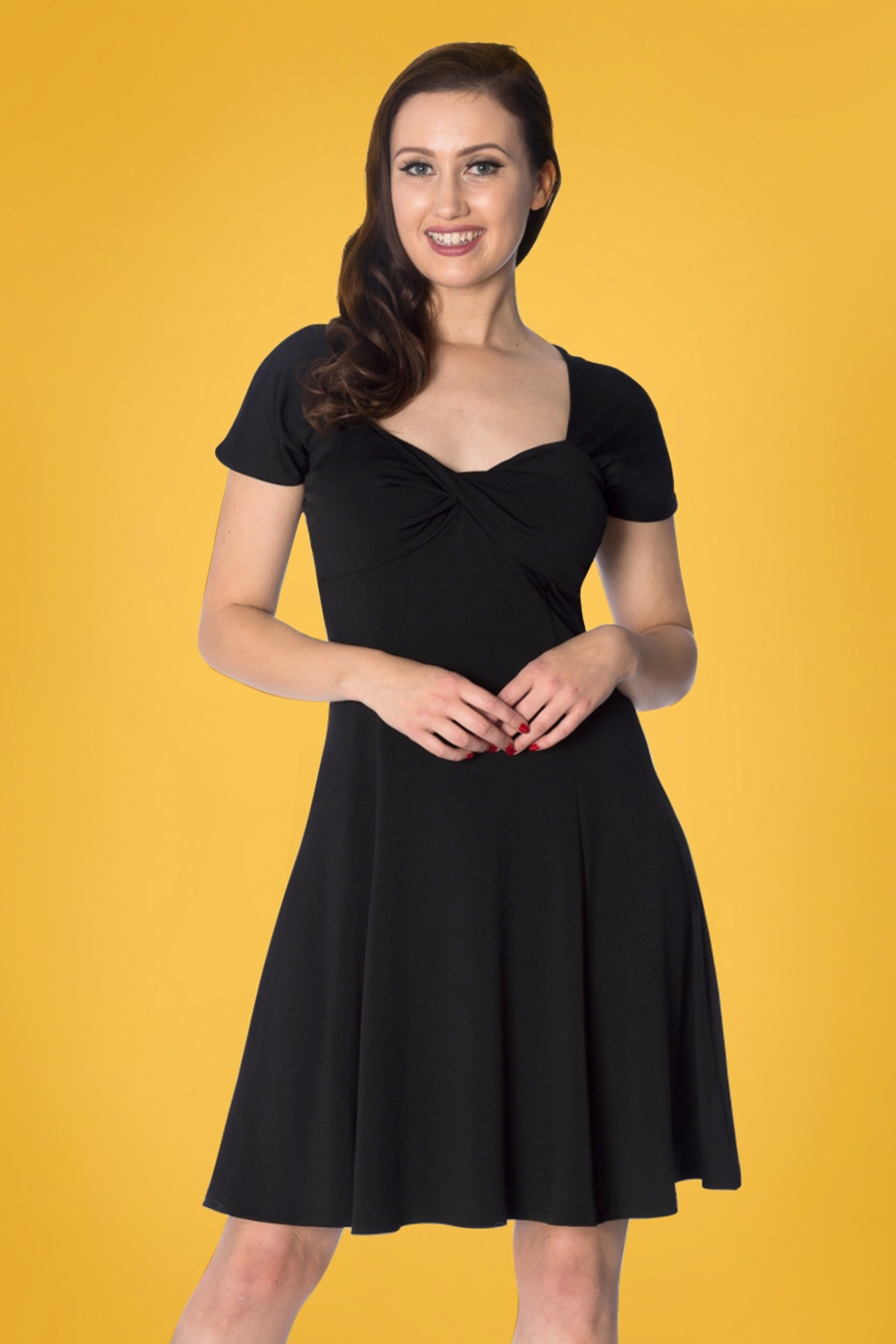 The twist dress The twist knot v-neckline and long sleeves create a flattering silhouette on this silky dress. Paired with our Raquel Heel, Stella Clutch, Dessa Beaded Statement Earrings, Chloe .