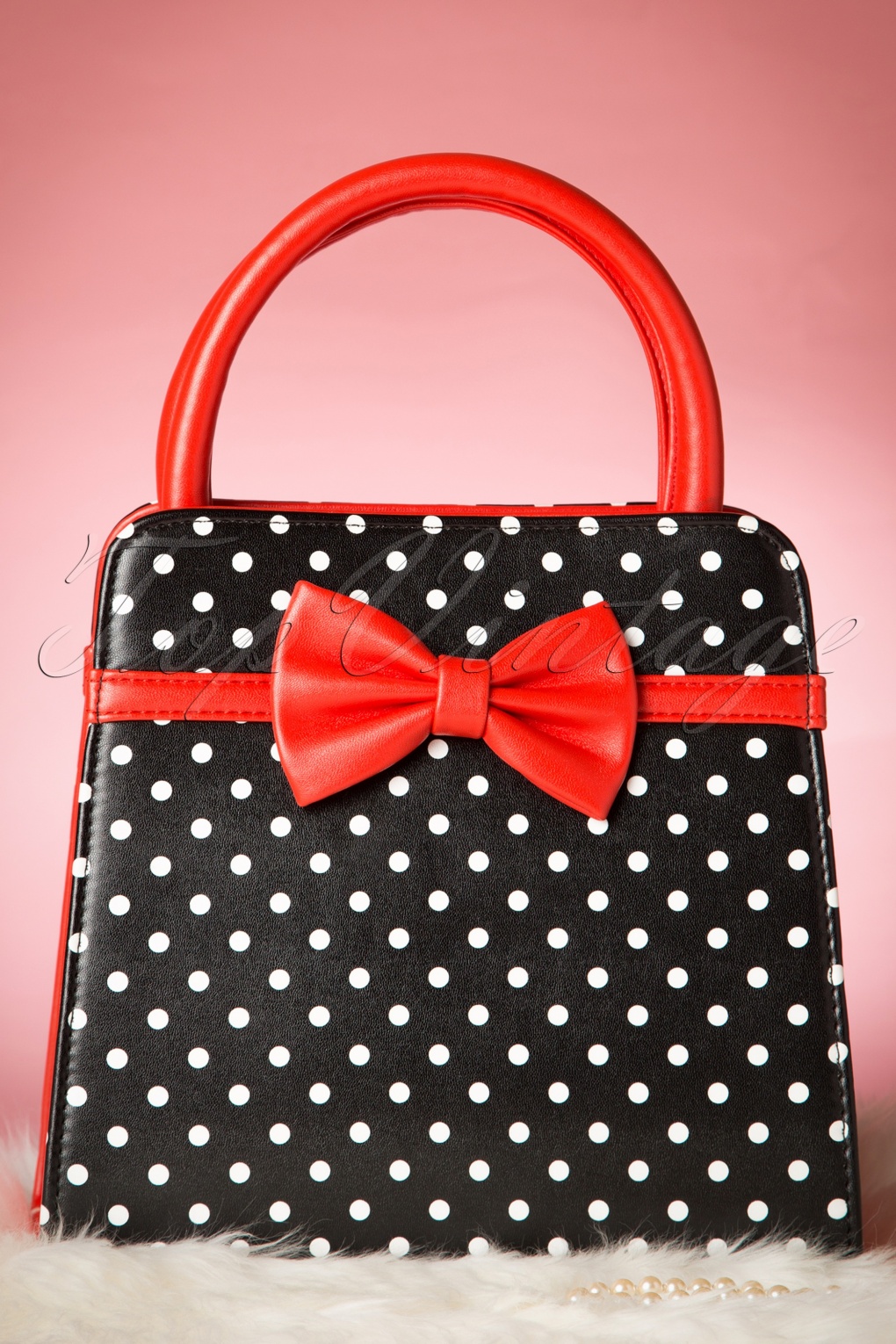 red polka dot purse